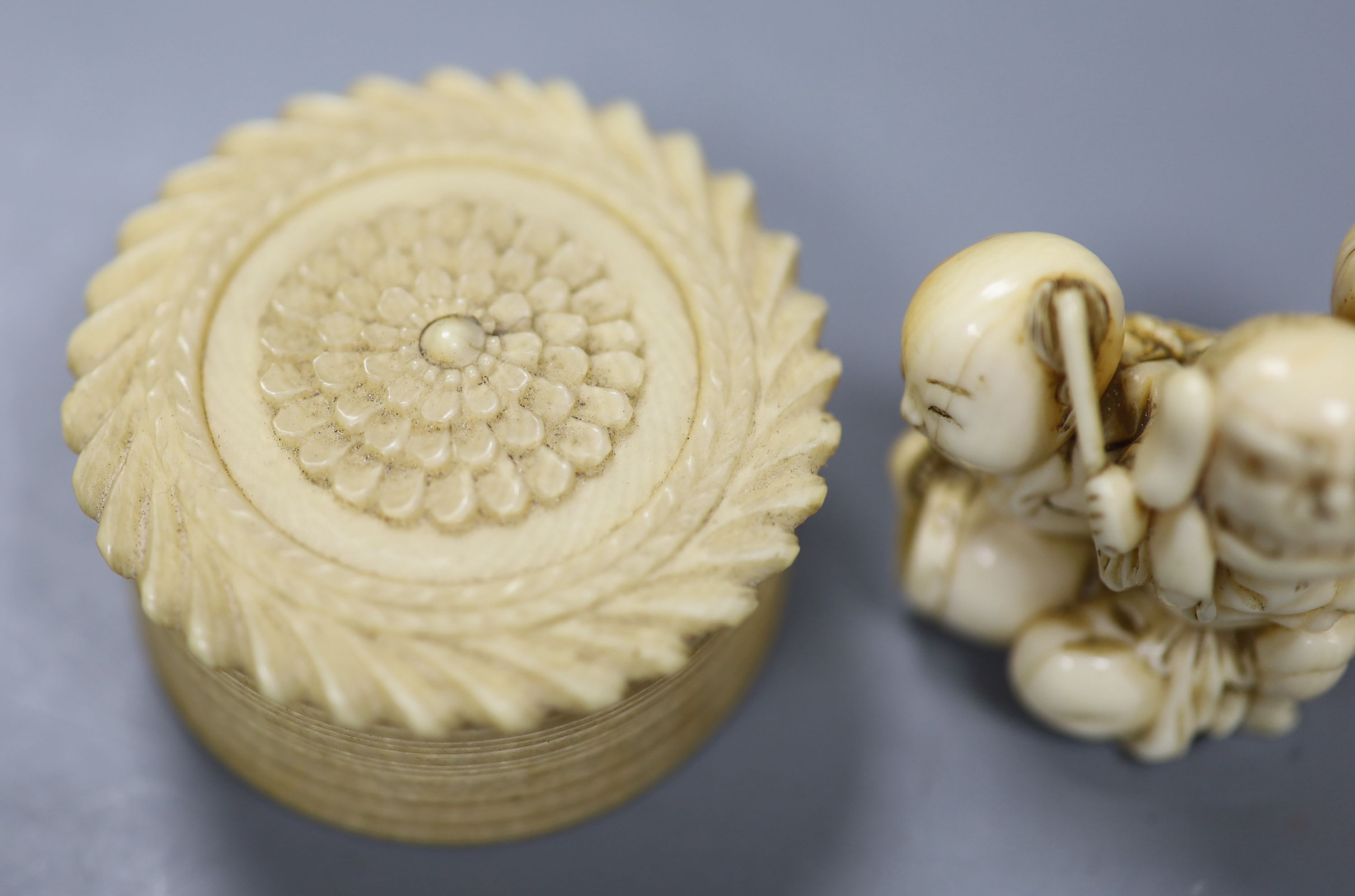 A 19th century Cantonese export carved ivory whist box, with a sliding floral panelled cover, and contents, 5 x 3.5cm together with a